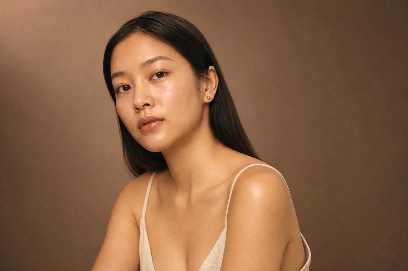 A woman in her twenties, clear skin, calm gaze