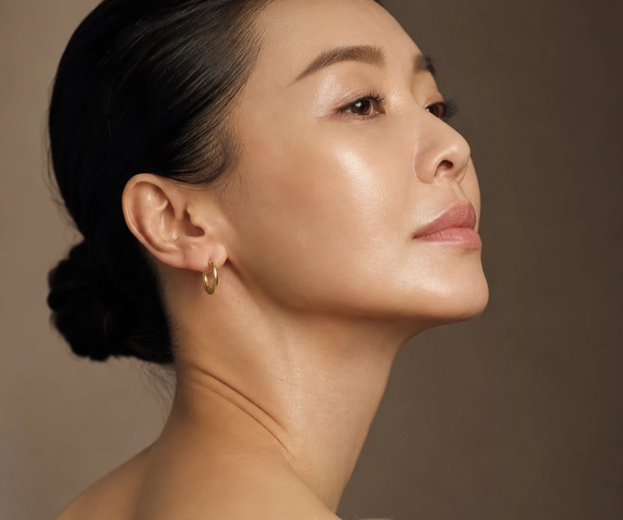 A woman in profile, jawline and neck clearly visible